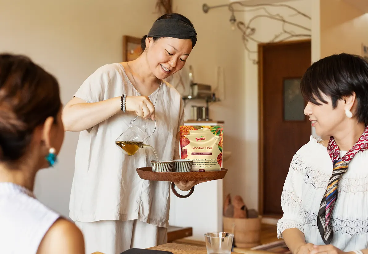 asian lady pouring tropace