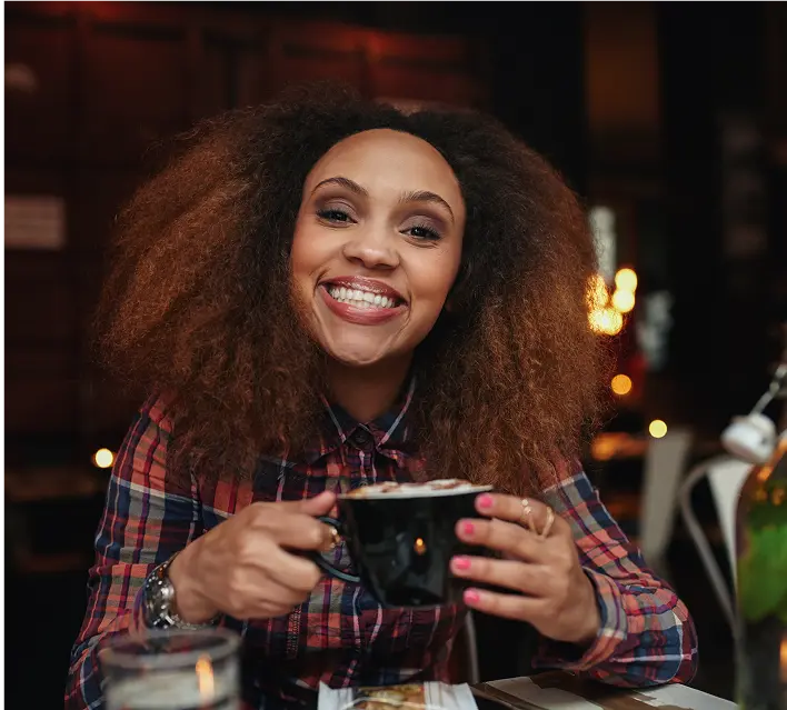 young-woman-drinking-coffee-at-cafe2-2024-09-23-00-09-55-utc
